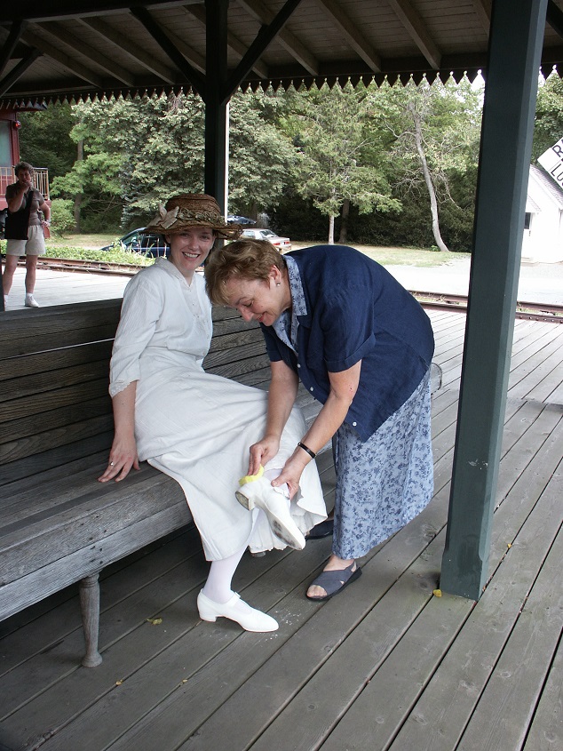 WPS's Elaine Yarris wipes mud from the actress' shoe